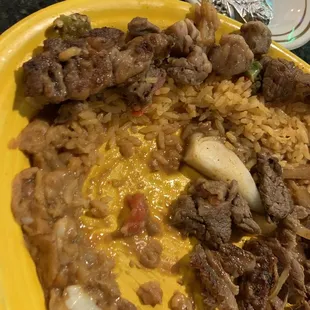 a plate of food with meat and rice