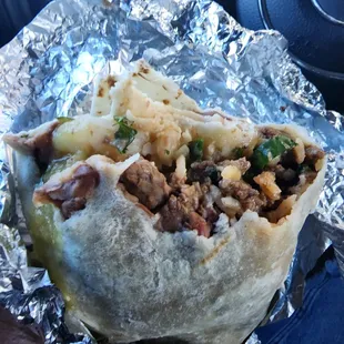 Big ass Burrito  Surf n Turf style   Absolutely delicious  Very nice owner. Shrimp and Asada.