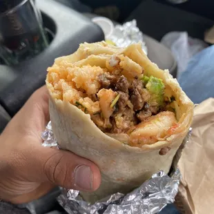 Order a 22. Shrimp Burrito and add carne asada to it!  Surf and turf burrito, thank me later!