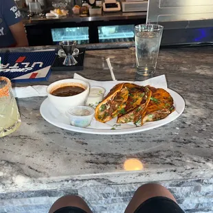 Birria taco and a margarita