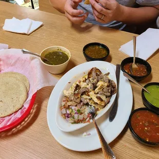 a plate of mexican food and a bowl of salsa