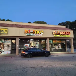 a car parked in front of a store