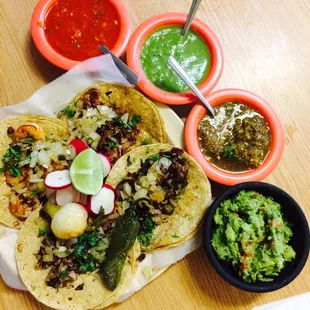 4 tacos (tripe, steak, tongue, and shrimp) with 3 different sauces and guacamole. The guacamole is one of the best I&apos;ve ever had