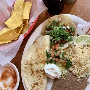 Shredded chicken Quesadilla and Al pastor taco lunch plate with half/half beans and rice, Mexican Coke, chips &amp; salsa