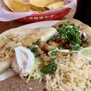 Shredded chicken Quesadilla and Al pastor taco lunch plate with half/half beans and rice