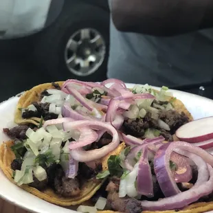 a person holding a plate of food