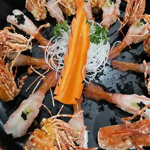 a plate of shrimp and vegetables