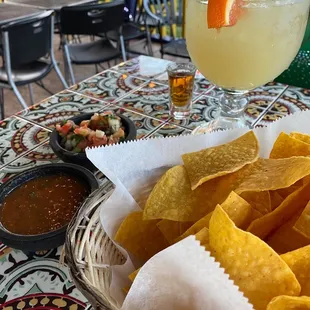 Crispy tortilla chips and salsa Roja and Pico de gallo