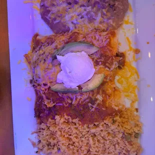 Saturday special  3 chicken enchiladas with refried beans and rice
