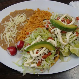 Sopas meal (pork and beef sopas) with rice, refried beans and salad