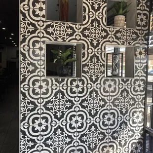 a black and white tile wall