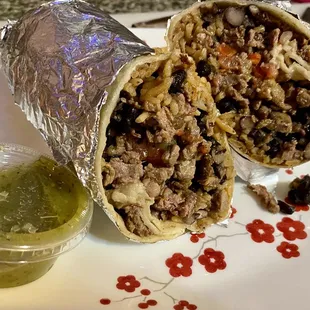 Carne asada regular burrito - lots of meat in every bite. Two containers of salsa and lots of chips (not pictured)