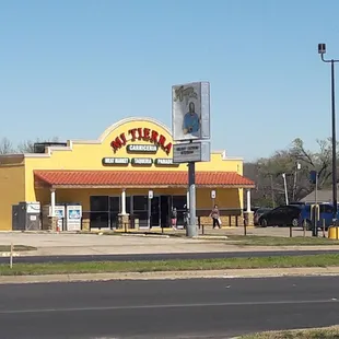 The store and it's parking lot from the street
