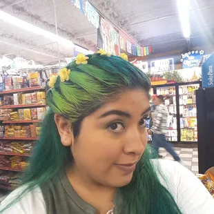 Check out my pretty braided hair with yellow flowers