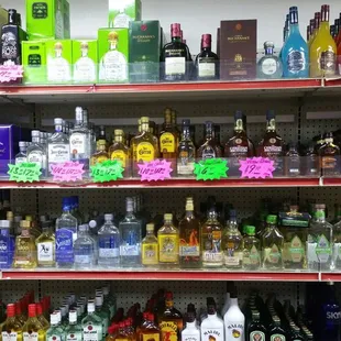 a shelf full of liquor