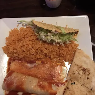 Chicken enchilada, cheese quesadilla, and a beef taco. Served with rice.