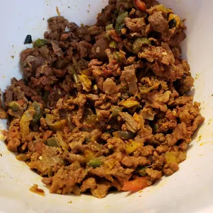 a white bowl filled with food