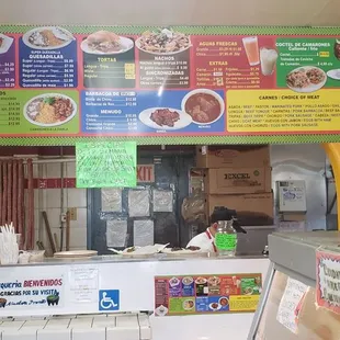 The menu and where you order at the back of the store