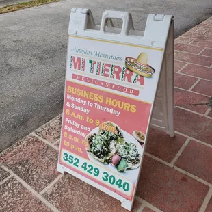 a sign for business hours