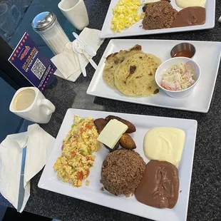 Scarbleb eggs, beans/rice, Sour cream, Plantain, cheese and tortillas