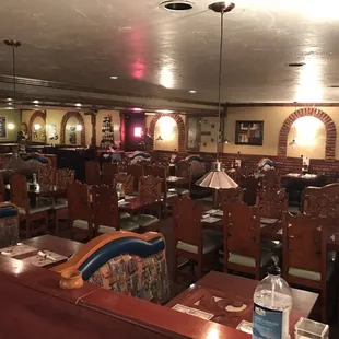 a dining room with tables and chairs