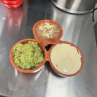 Trío Mexicano: cheese sauce, bean dip and guacamole dip