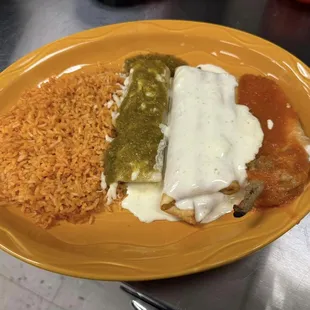 La Bandera Mexicana- enchilada topped with green sauce, chimichanga topped with white sauce, chile relleno topped w/red sauce served w/rice
