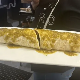 Mega Burrito- Two 12 in burritos filled with rice, beans, pico, cheese. With your choice of meat: steak, chicken, al pastor w/ salsa verde.