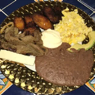 Desayuno Tipico/Tipico breakfast: eggs, sweet plantains, avocado, a slice of honduran cheese and fried beans