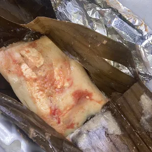 Yummy tamale on banana leaf.