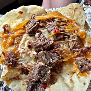 Guisada taco with cheese