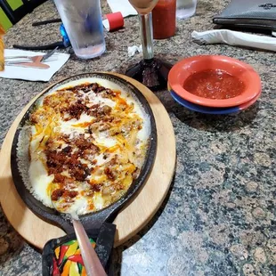 Queso fundido and prickly pear margarita
