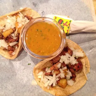 $2.00 each, Tacos Al Pastor. These are corn but you can get flour &amp; come with cilantro, I requested it be left off. Chile sauce is very hot!