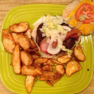 Warrior Burger and fries $8.75. (Very sweet bun) mayo, lettuce, tomato, onion and bacon (bacon was undercooked tonight)