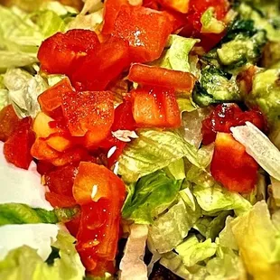a salad with tomatoes and lettuce
