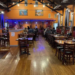 a restaurant with wood floors