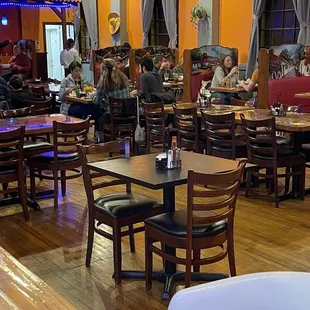 a restaurant with tables and chairs