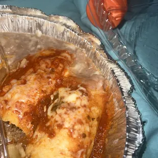 Enchilada and tamale both with enchilada sauce