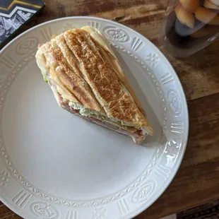 Half of the Cuban sandwich that I shared with my friend. The footlong sandwich was only 10 dollars and was piled well and delicious.