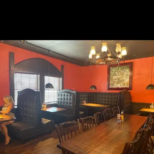 a woman sitting at a table in a restaurant