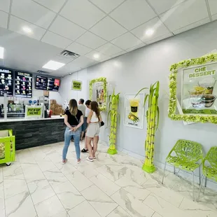 a group of people standing in front of a counter