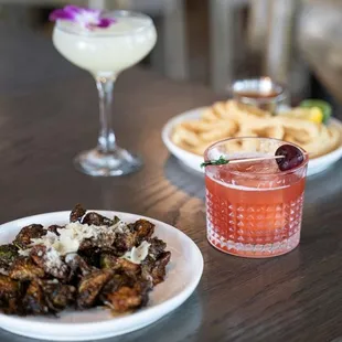 two plates of food and a drink