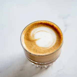 a cup of coffee on a table