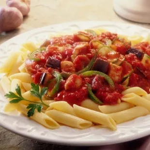 a plate of pasta with vegetables