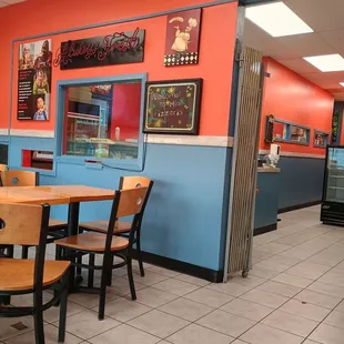 An open dining and waiting area with tv.