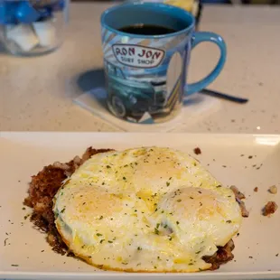 Corned Beef Hash and three eggs over medium.