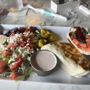 Baby Greek salad and veggie wrap delicious