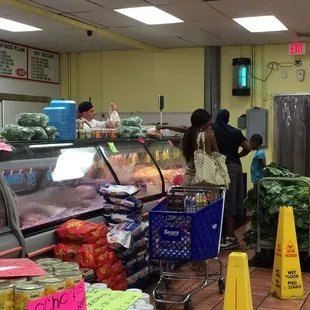 people shopping in a grocery store