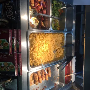 a variety of food in a buffet