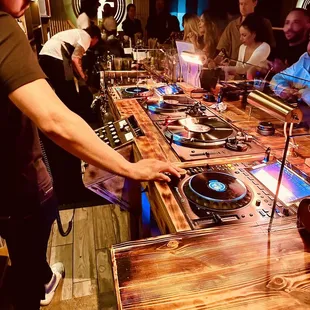 a dj mixing music on a turntable